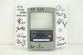 photo:Our ultrasound therapy device was signed by the Japanese Men's National Team at the 2006 Asian Games (Doha)